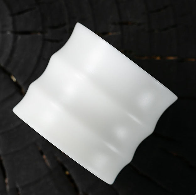 thin walled Dehua jade porcelain tea cup look from the side